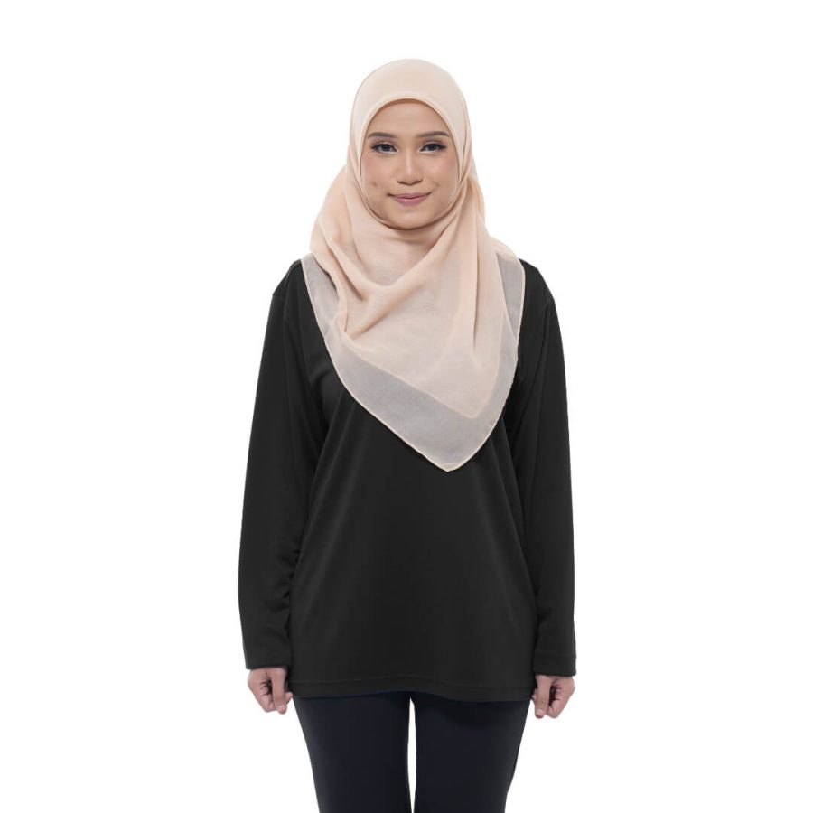 A woman wearing a cream colored hijab, black plain top and black pants.